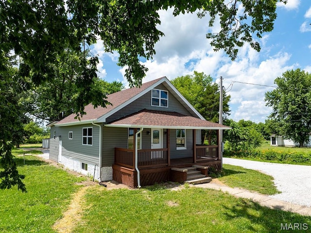 6596 County Road 263, Hannibal, MO 63401 - view of front of property featuring a porch, roof with shingles, and a front yard