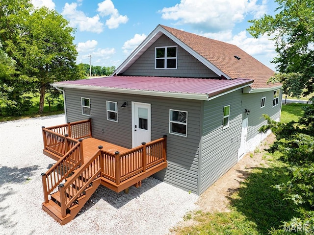 6596 County Road 263, Hannibal, MO 63401 - back of house with a wooden deck and a metal roof