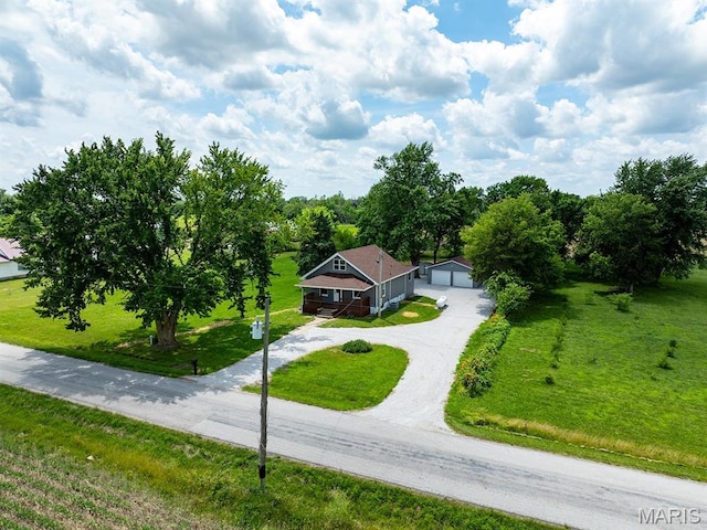 6596 County Road 263, Hannibal, MO 63401 - view of front of house featuring a front lawn, an outbuilding, and a garage