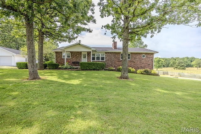 16930 Grace Rd, Lebanon, MO 65536 - single story home featuring a chimney and brick siding