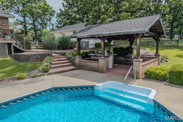 16930 Grace Rd, Lebanon, MO 65536 - outdoor pool with a gazebo, stairs, a patio area, and an outdoor kitchen