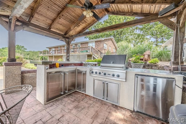 16930 Grace Rd, Lebanon, MO 65536 - view of patio with a ceiling fan, exterior kitchen, and a gazebo