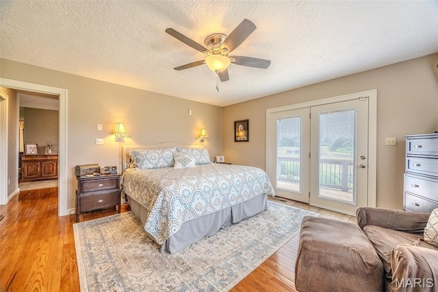 16930 Grace Rd, Lebanon, MO 65536 - bedroom with access to outside, light wood-style floors, a textured ceiling, and a ceiling fan