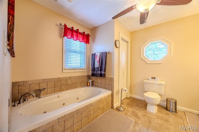 16930 Grace Rd, Lebanon, MO 65536 - full bath with a whirlpool tub, ceiling fan, and tile patterned flooring