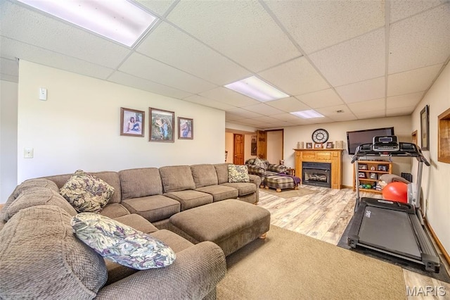 16930 Grace Rd, Lebanon, MO 65536 - living area with wood finished floors, a drop ceiling, and a fireplace