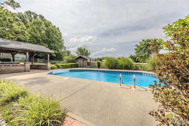 16930 Grace Rd, Lebanon, MO 65536 - view of swimming pool featuring a gazebo, a patio area, and an outbuilding