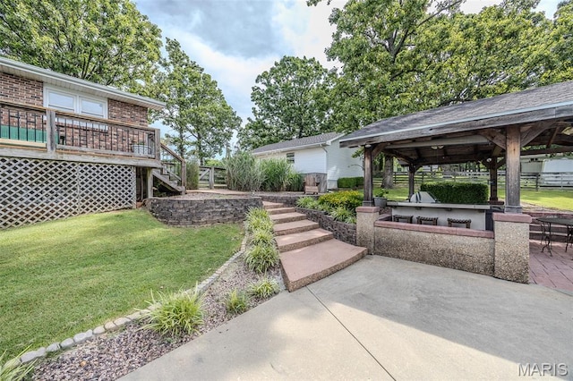 16930 Grace Rd, Lebanon, MO 65536 - view of green lawn featuring a gazebo, stairway, a patio, and a deck