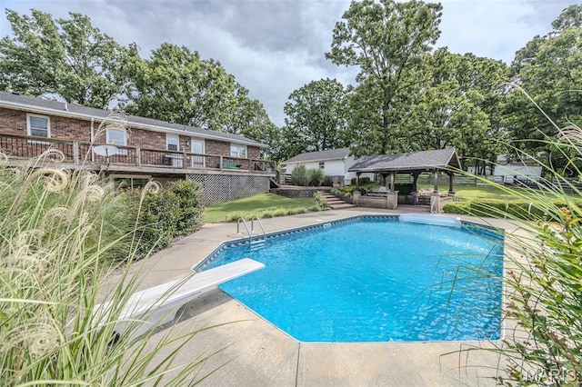 16930 Grace Rd, Lebanon, MO 65536 - outdoor pool featuring a gazebo, a deck, a patio, and a diving board