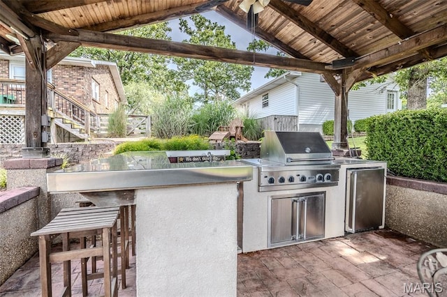16930 Grace Rd, Lebanon, MO 65536 - view of patio / terrace with an outdoor kitchen and stairs