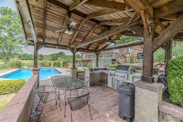16930 Grace Rd, Lebanon, MO 65536 - view of patio with a ceiling fan, area for grilling, an outdoor pool, stairs, and outdoor dining space