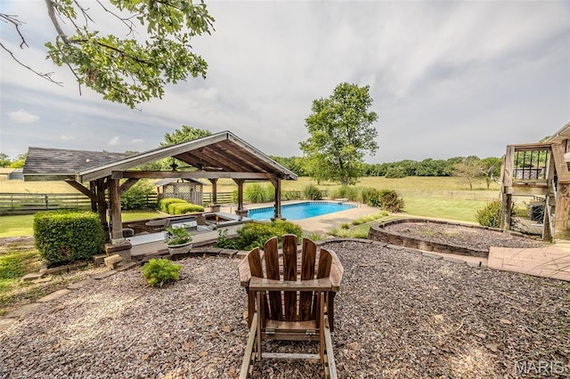 16930 Grace Rd, Lebanon, MO 65536 - view of yard featuring a gazebo, an outdoor pool, a patio, and a ceiling fan