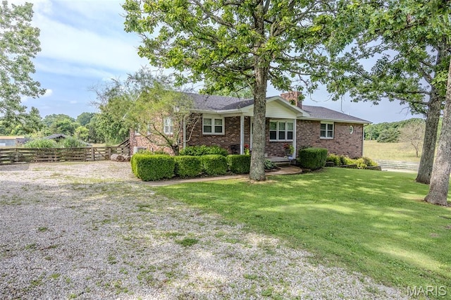 16930 Grace Rd, Lebanon, MO 65536 - ranch-style home with brick siding and a chimney