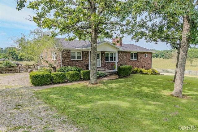 16930 Grace Rd, Lebanon, MO 65536 - single story home with a chimney and brick siding