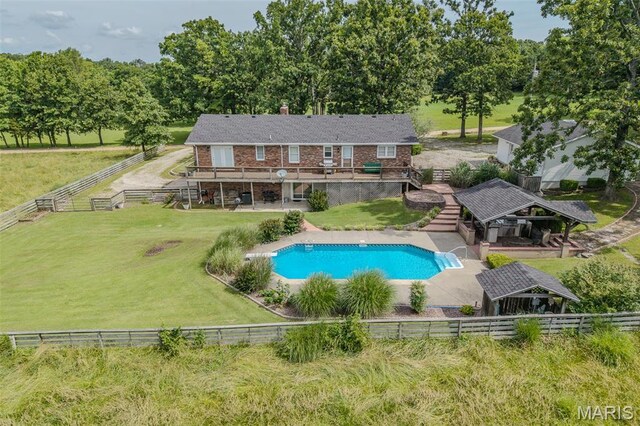 16930 Grace Rd, Lebanon, MO 65536 - view of pool featuring a wooden deck, a fenced backyard, stairway, and a gazebo