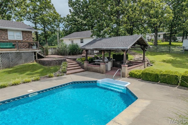 16930 Grace Rd, Lebanon, MO 65536 - swimming pool featuring a gazebo, an outdoor kitchen, stairs, a wooden deck, and a patio area