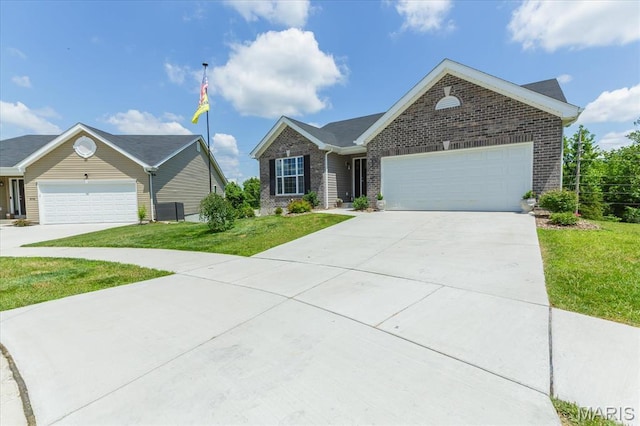 8280 Obrien Dr, Cedar Hill, MO 63016 - ranch-style home with a garage, driveway, brick siding, and a front yard