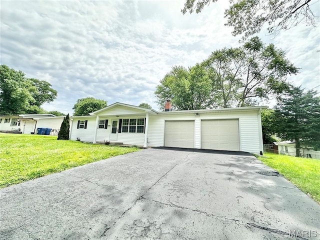 4 Fairview Dr, Saint Charles, MO 63303 - single story home with driveway, an attached garage, and a front yard