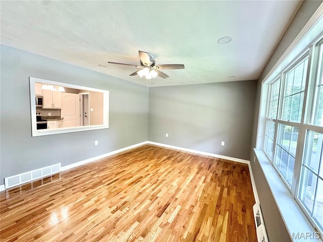 4 Fairview Dr, Saint Charles, MO 63303 - spare room with wood finished floors and ceiling fan