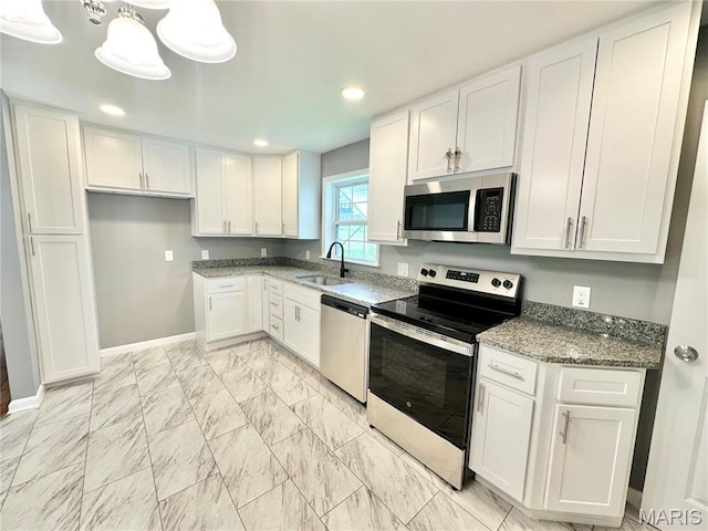 4 Fairview Dr, Saint Charles, MO 63303 - kitchen with appliances with stainless steel finishes, white cabinets, stone countertops, recessed lighting, and light marble finish flooring
