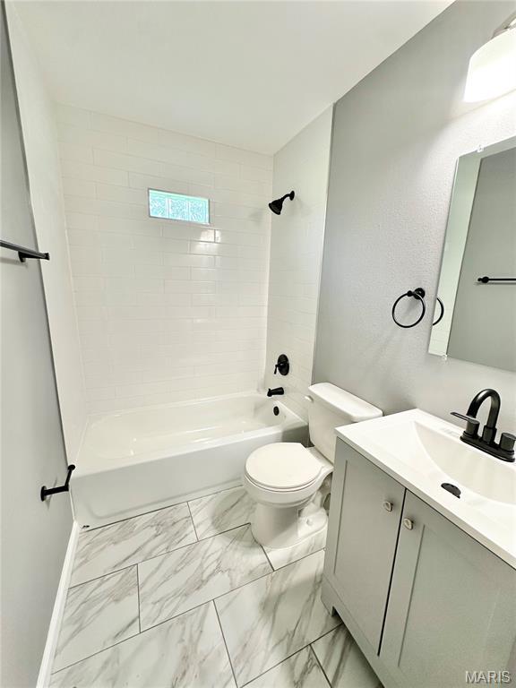4 Fairview Dr, Saint Charles, MO 63303 - full bath with vanity, marble look tile flooring, and bathing tub / shower combination