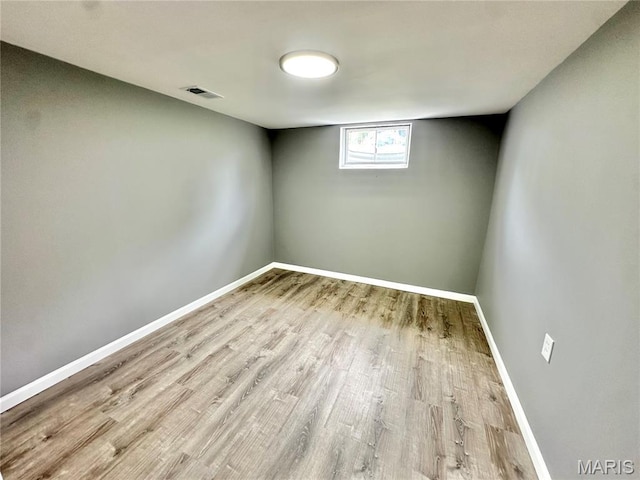 4 Fairview Dr, Saint Charles, MO 63303 - below grade area featuring wood finished floors and baseboards