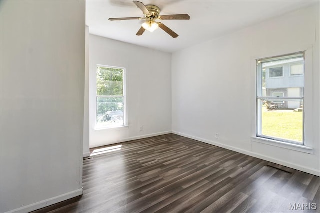 1009 S 3rd St, De Soto, MO 63020 - empty room featuring dark wood-style floors and ceiling fan
