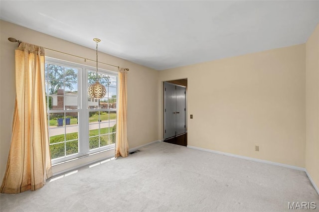 7849 Cassia Ct, Saint Louis, MO 63123 - empty room with carpet and healthy amount of natural light