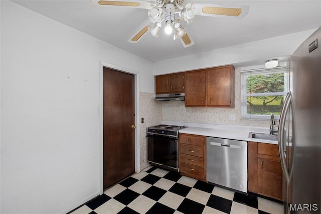7849 Cassia Ct, Saint Louis, MO 63123 - kitchen with appliances with stainless steel finishes, light flooring, light countertops, and ceiling fan