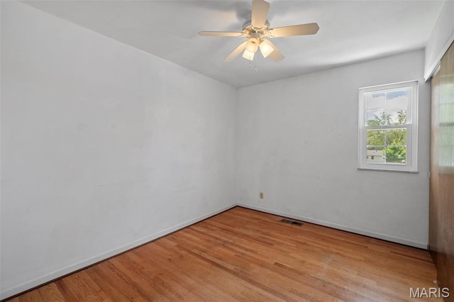7849 Cassia Ct, Saint Louis, MO 63123 - spare room featuring wood finished floors and a ceiling fan