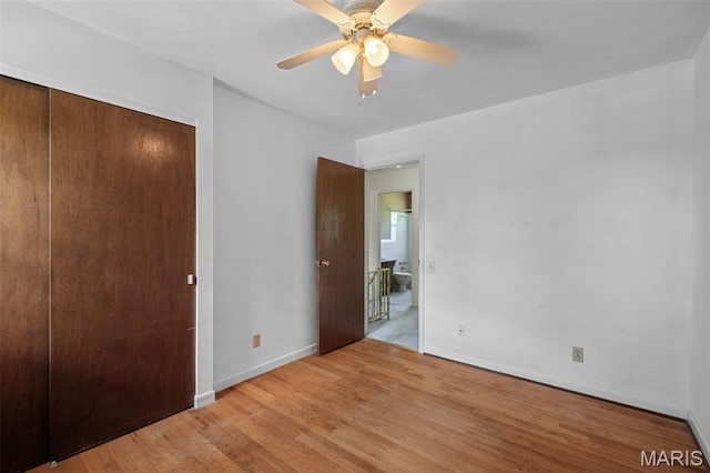 7849 Cassia Ct, Saint Louis, MO 63123 - unfurnished bedroom featuring light wood finished floors, a closet, and ceiling fan