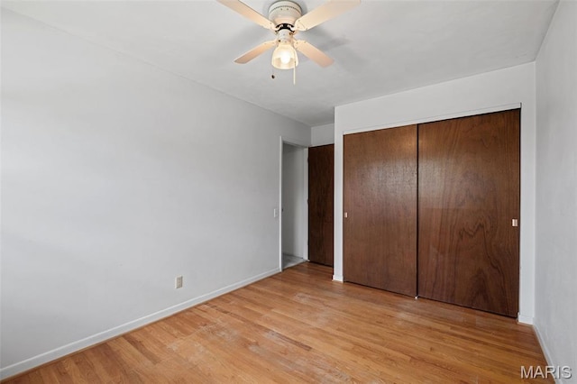 7849 Cassia Ct, Saint Louis, MO 63123 - unfurnished bedroom with light wood-style floors, a closet, and ceiling fan