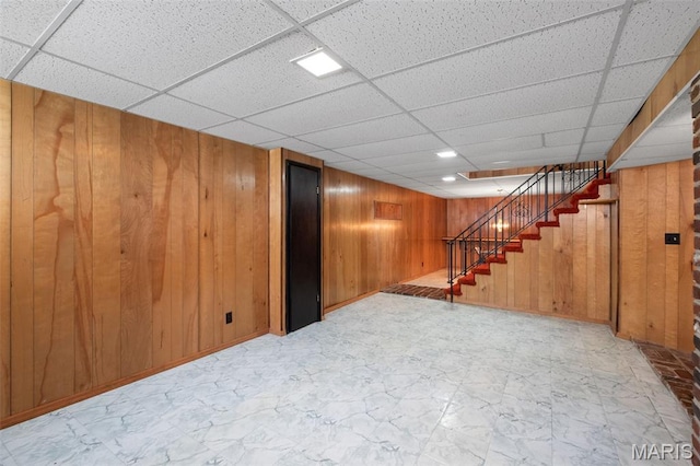 7849 Cassia Ct, Saint Louis, MO 63123 - finished basement with wood walls, a paneled ceiling, and stairway