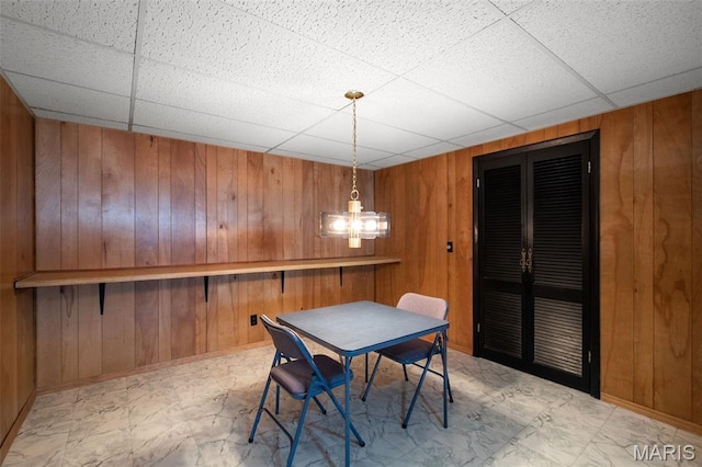 7849 Cassia Ct, Saint Louis, MO 63123 - dining room featuring a paneled ceiling and wood walls