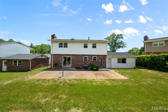 7849 Cassia Ct, Saint Louis, MO 63123 - back of house featuring a patio, brick siding, a lawn, and a chimney