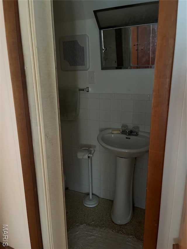 121 N 13th St, Louisiana, MO 63353 - bathroom with tile walls and a sink