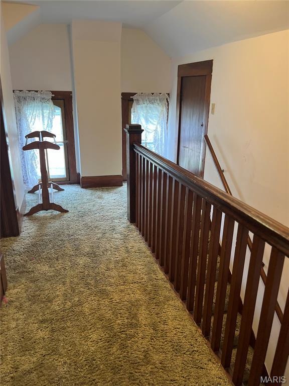 121 N 13th St, Louisiana, MO 63353 - hall with an upstairs landing, carpet, and lofted ceiling