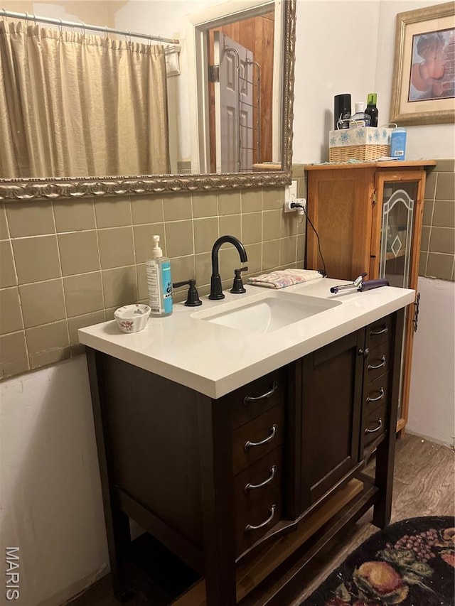 121 N 13th St, Louisiana, MO 63353 - bathroom with tile walls, vanity, a bath, and a shower with curtain