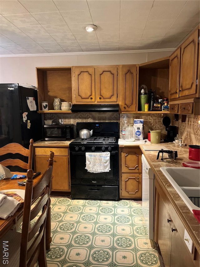 121 N 13th St, Louisiana, MO 63353 - kitchen with black appliances, open shelves, under cabinet range hood, and decorative backsplash
