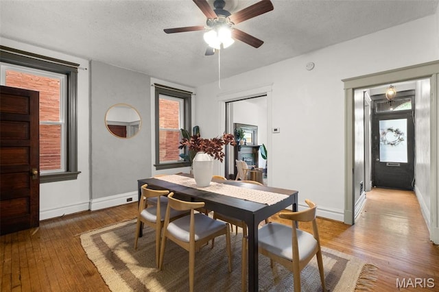 2929 Victor St, Saint Louis, MO 63104 - dining area featuring light wood-type flooring, ceiling fan, and a textured ceiling