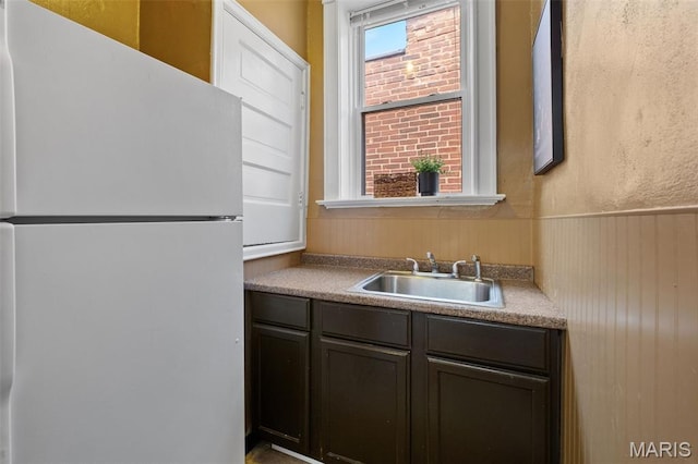2929 Victor St, Saint Louis, MO 63104 - kitchen with freestanding refrigerator and a wainscoted wall