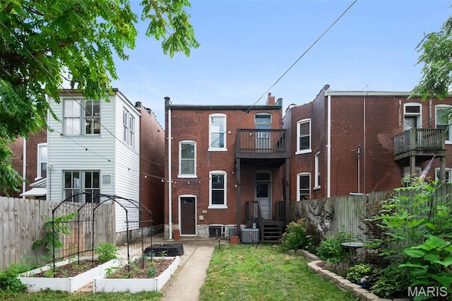 2929 Victor St, Saint Louis, MO 63104 - view of front facade with a garden and brick siding