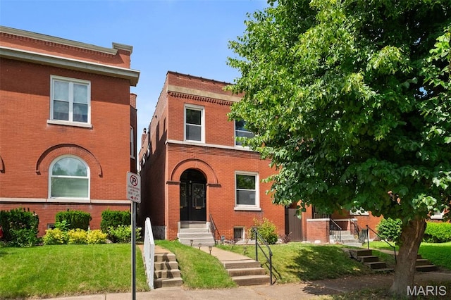 2929 Victor St, Saint Louis, MO 63104 - view of front of house with brick siding and a front lawn