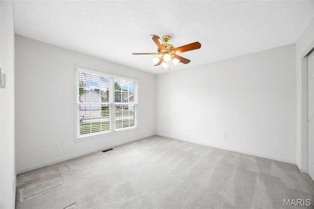 2749 Samuel Dr Unit 736A, Dardenne Prairie, MO 63368 - empty room with light colored carpet, a ceiling fan, and a textured ceiling