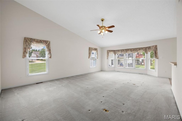 2749 Samuel Dr Unit 736A, Dardenne Prairie, MO 63368 - unfurnished living room featuring carpet flooring, vaulted ceiling, plenty of natural light, and a ceiling fan