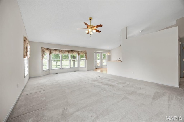 2749 Samuel Dr Unit 736A, Dardenne Prairie, MO 63368 - unfurnished living room with vaulted ceiling, a ceiling fan, and light carpet
