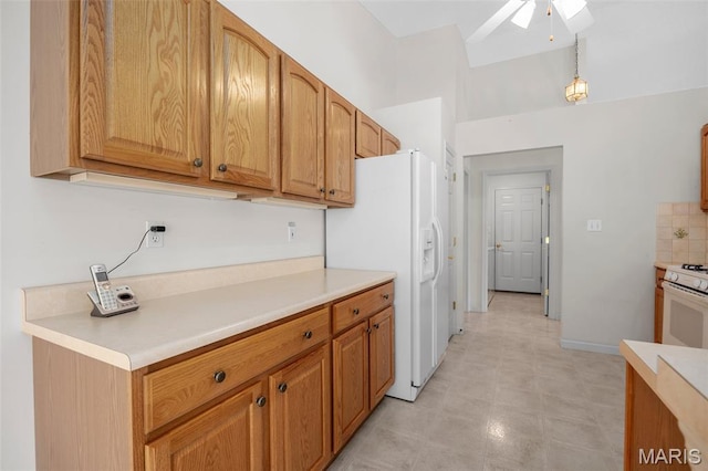 2749 Samuel Dr Unit 736A, Dardenne Prairie, MO 63368 - kitchen featuring white appliances, ceiling fan, light countertops, light flooring, and brown cabinetry