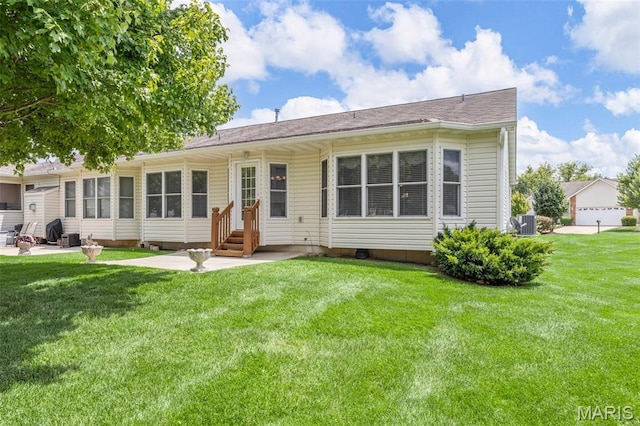 2749 Samuel Dr Unit 736A, Dardenne Prairie, MO 63368 - back of property with entry steps, a patio, and a yard