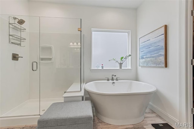 2308 Sand Cherry Dr, Wildwood, MO 63011 - bathroom with a shower stall, a soaking tub, and wood finished floors