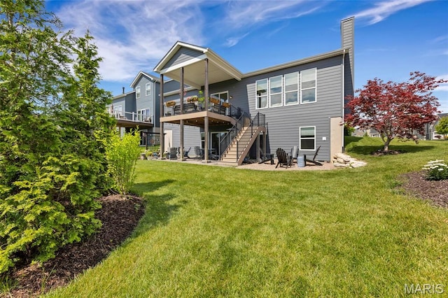 2308 Sand Cherry Dr, Wildwood, MO 63011 - back of property featuring a chimney, stairway, a yard, a wooden deck, and a patio