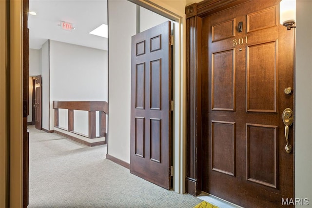 4570 Laclede Ave Unit 301, Saint Louis, MO 63108 - hall with light colored carpet and baseboards